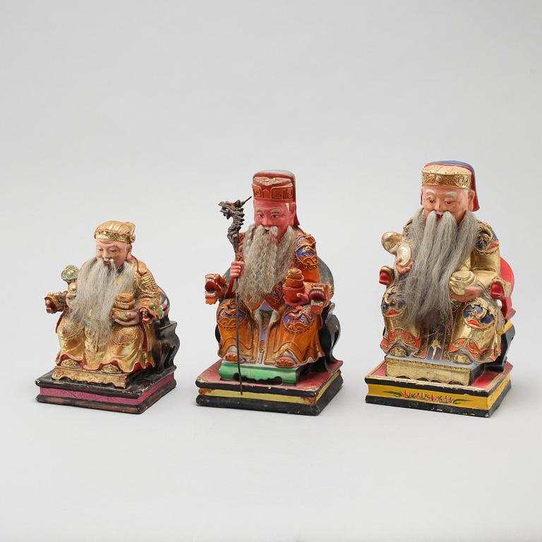 A set of three wooden deities, China, early 20th Century.