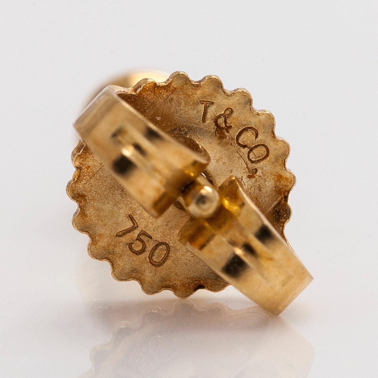 Tiffany & Co, Elsa Peretti, a pair of 18K gold 'Diamonds by The Yard' earrings with brilliant-cut diamonds.