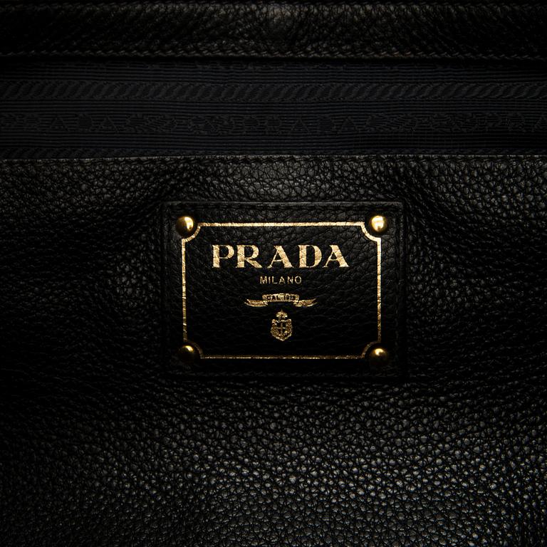 Prada, A 'Vitello Daino Tote' bag.