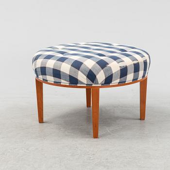 Josef Frank, a model 647 cherry wood stool by Firma Svenskt Tenn.