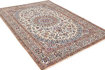 A Nain carpet, 9 laa, part silk, Iran, c. 335 x 245 cm.