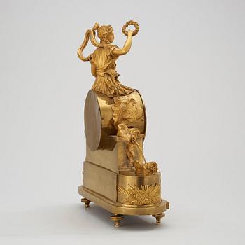 A French Empire early 19th century gilt bronze mantel clock.