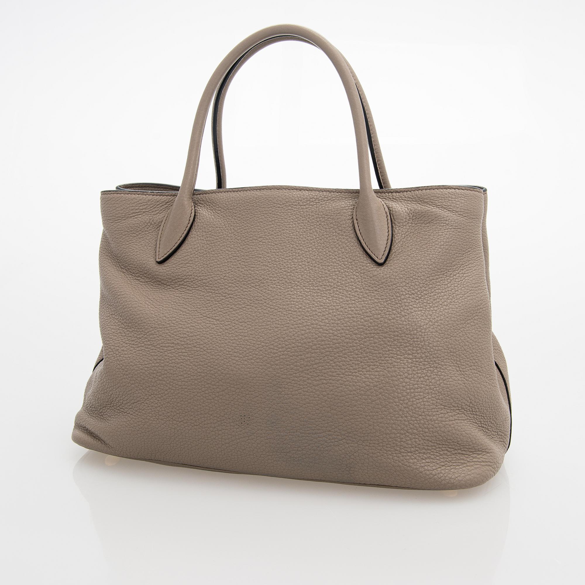 Prada, a clay gray leather handbag, 2020.