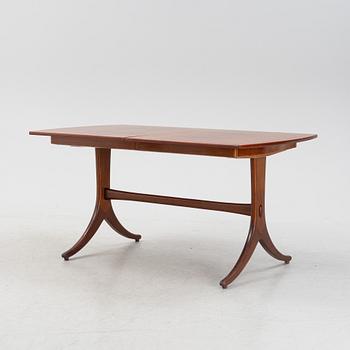 A mahogany and rosewood veneered dining table, mid 20th Century.