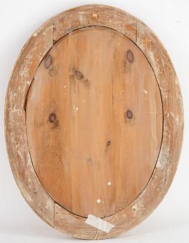An oval mirror from around the year 1900.