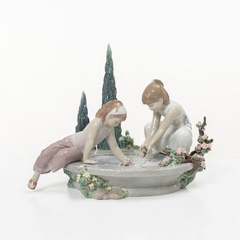 Lladró, three figurines,"Girl with French bulldog", "Girl with Dalmatians" and "Petals in the pond", Spain.