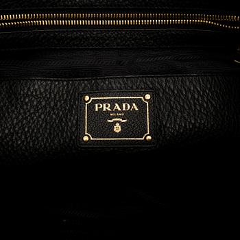 Prada, A 'Vitello Daino Tote' bag.