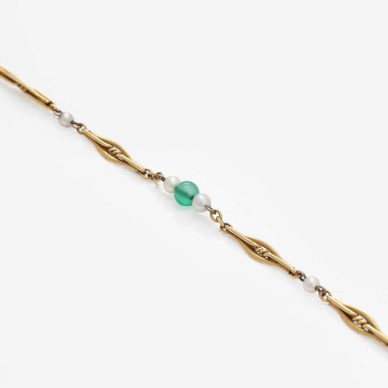 A 17K gold necklace with emeralds and cultured pearls.