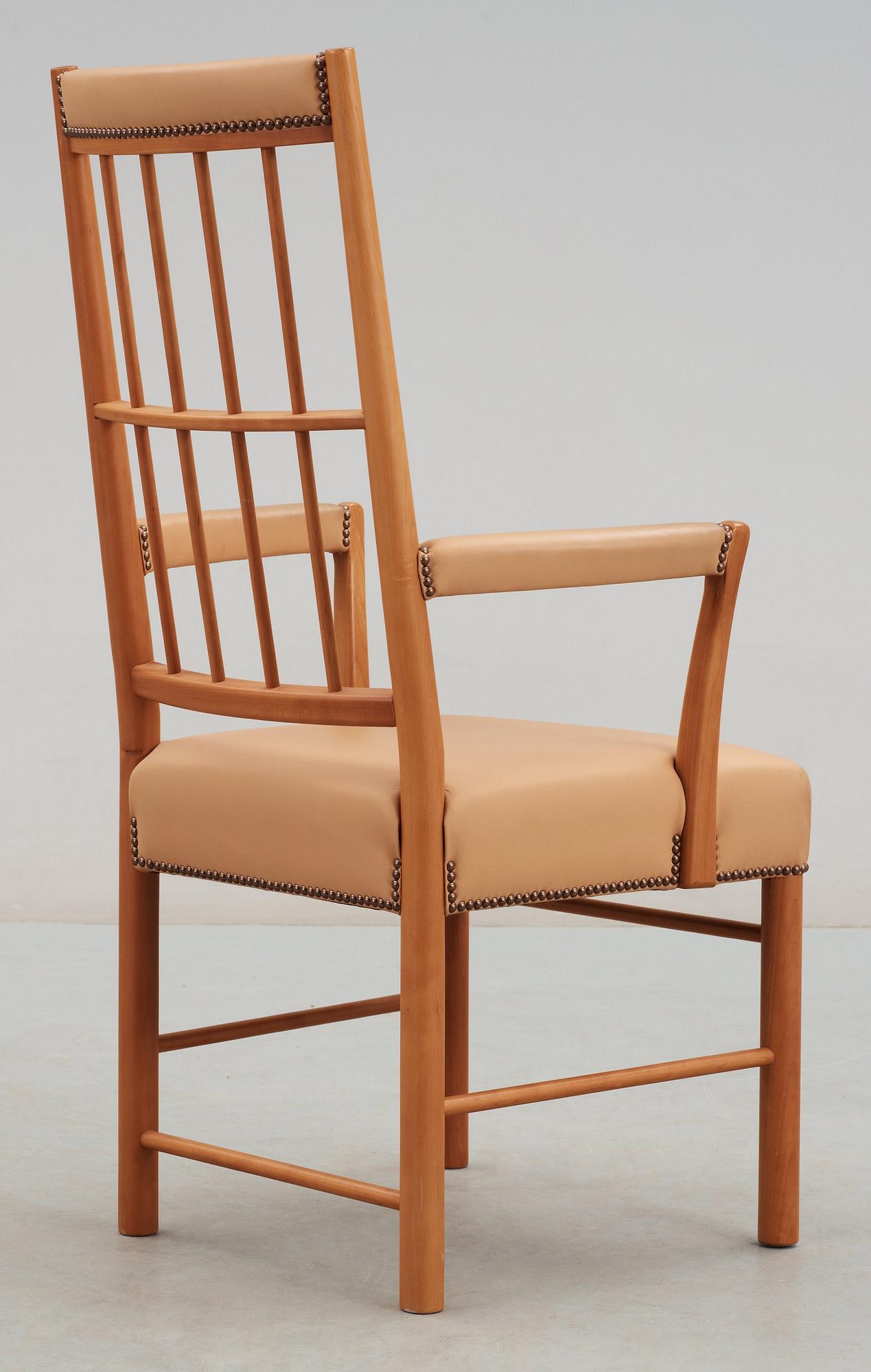 A Josef Frank cherry and beige leather armchair, Svenskt Tenn 2007, model 652.