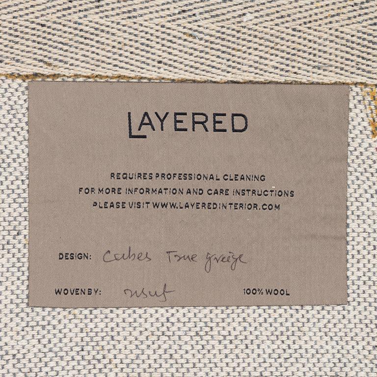 A 'Cubes' carpet, Layered, c. 270 x 180 cm.