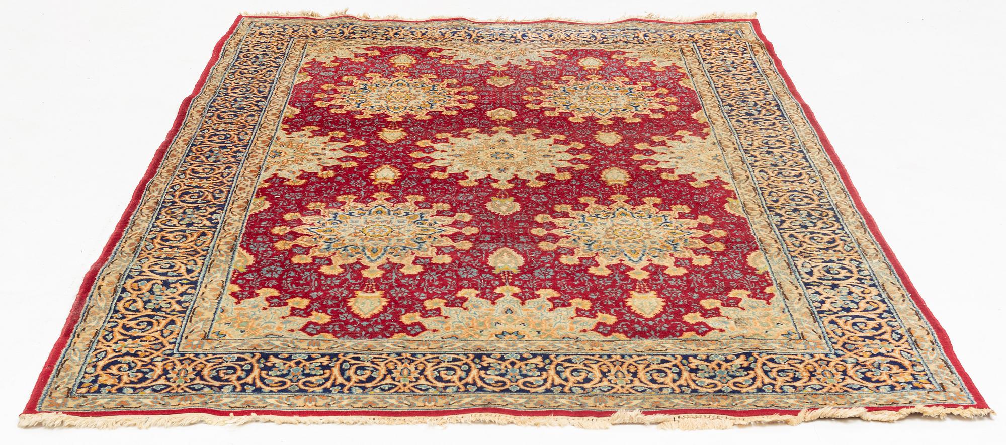 An oriental carpet, c. 290 x 198 cm.