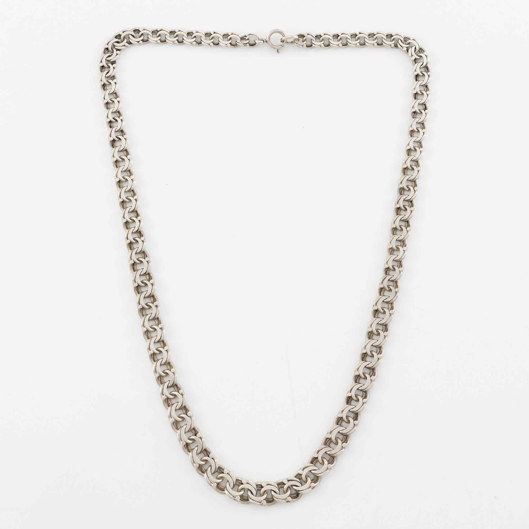 Necklace, graduated Bismarck link, silver.