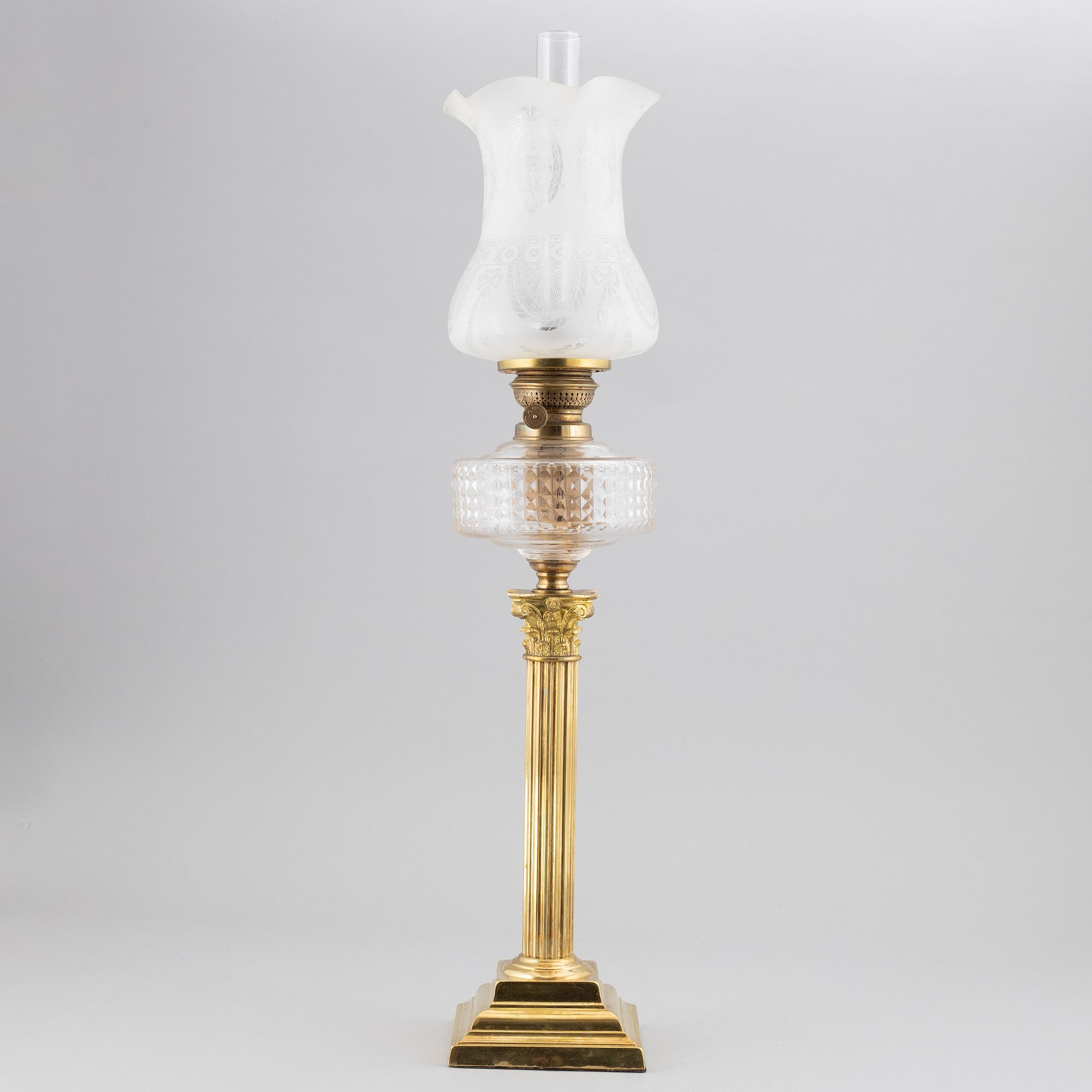 A brass oil lamp, ca 1900.