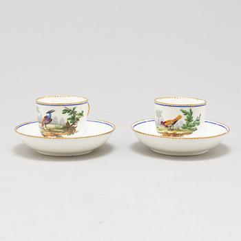 A pair of cups and saucers, "Sévrès"like mark, 19th century.