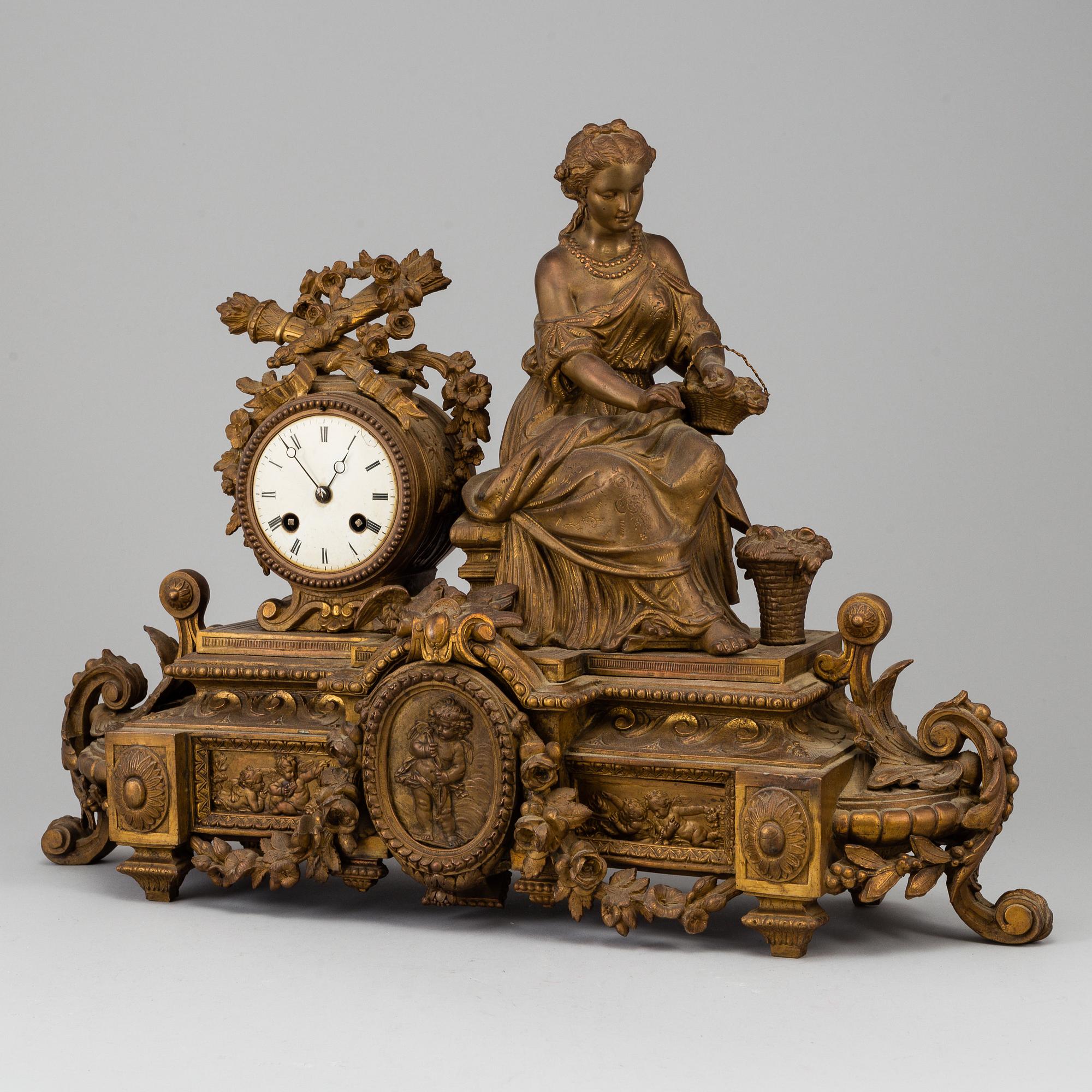 A  French 19th century mantle clock in Louis-XVI style.