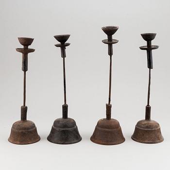 A group of four temple candle sticks, China, 20th Century.