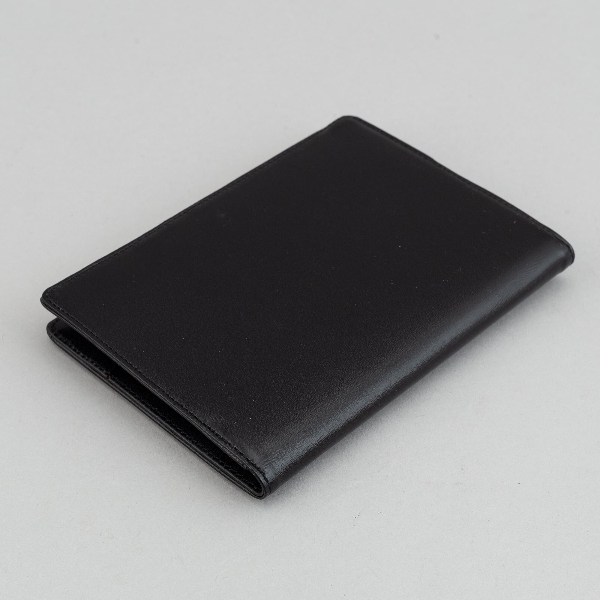 MOntblanc, a ball point pen and leather passport holder.