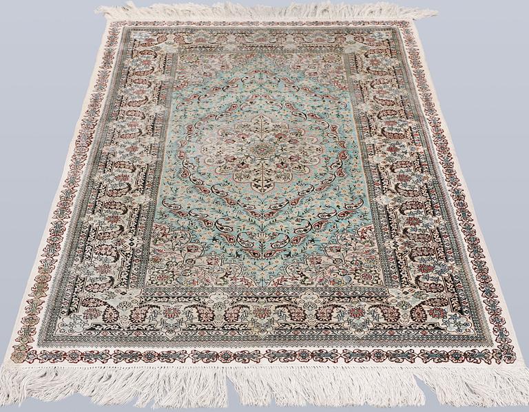An Oriental silk rug, approx. 154 x 91 cm.
