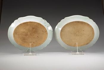 A pair of famille rose 'double peacock' serving dishes, Qing dynasty, Qianlong (1736-95).