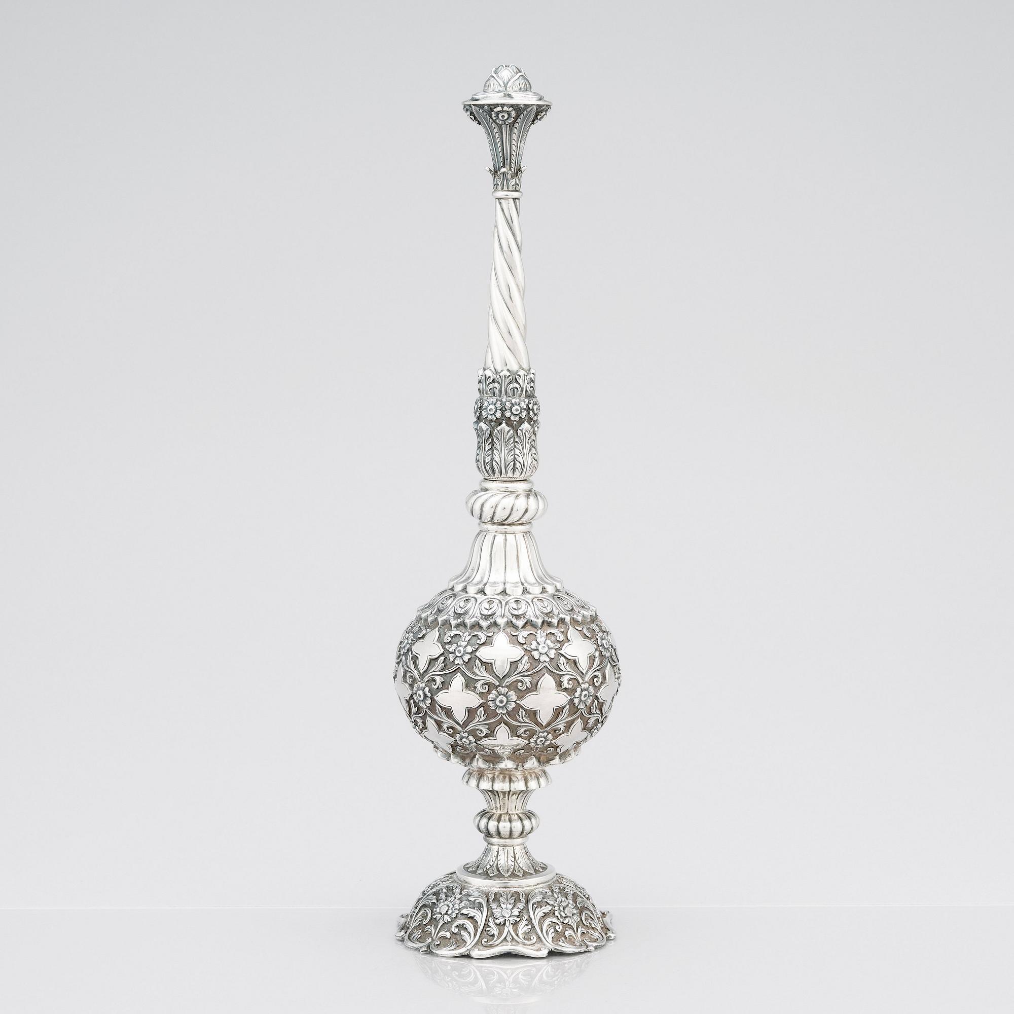An 1880's british Raj repoussé silver rosewater sprinkler by Oomersi Mawji & Sons.