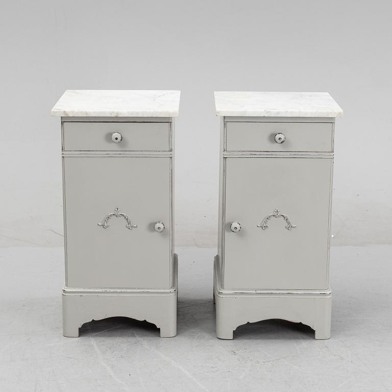 A pair of marble top bedside tables, first half of the 20th Century.