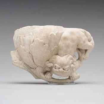 A wall vase in the shape of a mythical creature with a lotus bud, presumably 18th Century.