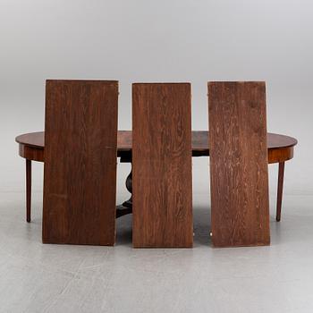 A mahogany veneered dining table, mid 19th Century.