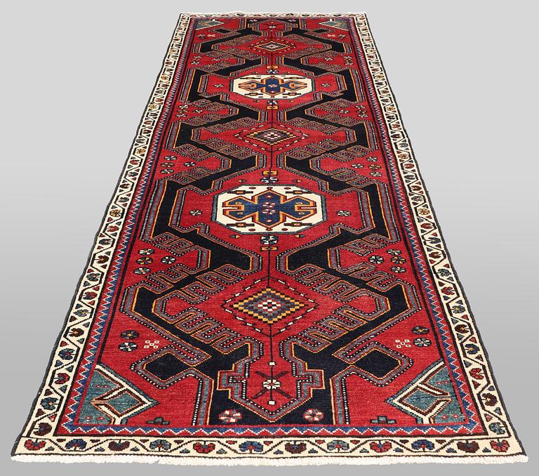 A semi-antique runner carpet, 295 x 100 cm.