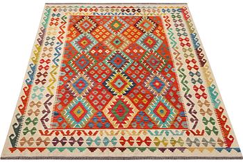 An Afghan Kilim rug, c. 214 x 182 cm.