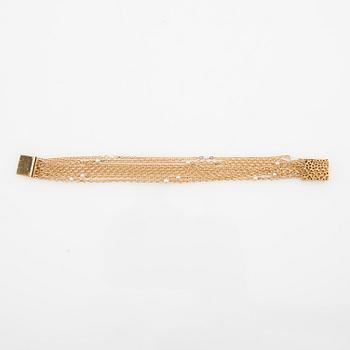 Bracelet 18K gold and seed pearls.