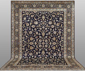 A Keshan carpet, signed, approx. 430 x 320 cm.