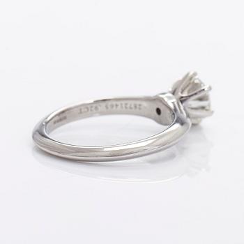 Tiffany & Co, a platinu solitaire ring with a brilliant-cut diamond.