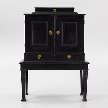 A South-German Baroque ebonized collector's cabinet on stand, circa 1700.