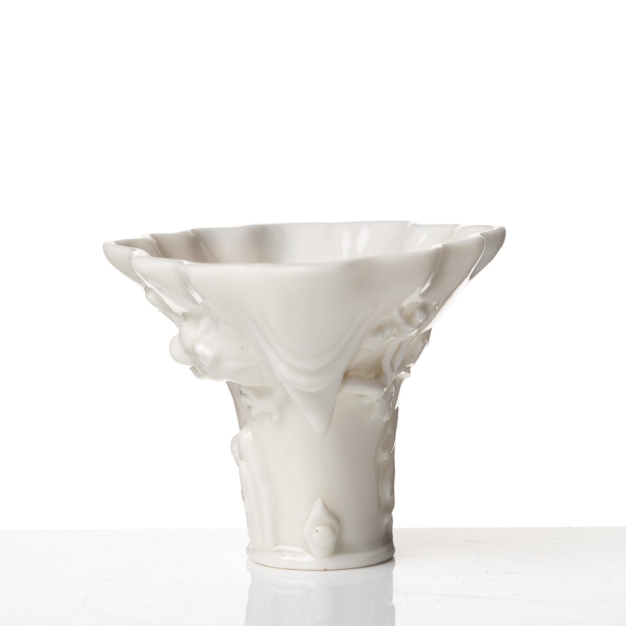 A blanc de chine rhinoserous libation cup, Qing dynasty, Kangxi (1662-1722).