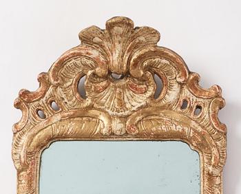 A Swedish gitlwood rococo mirror, Stockholm, later part 18th century.