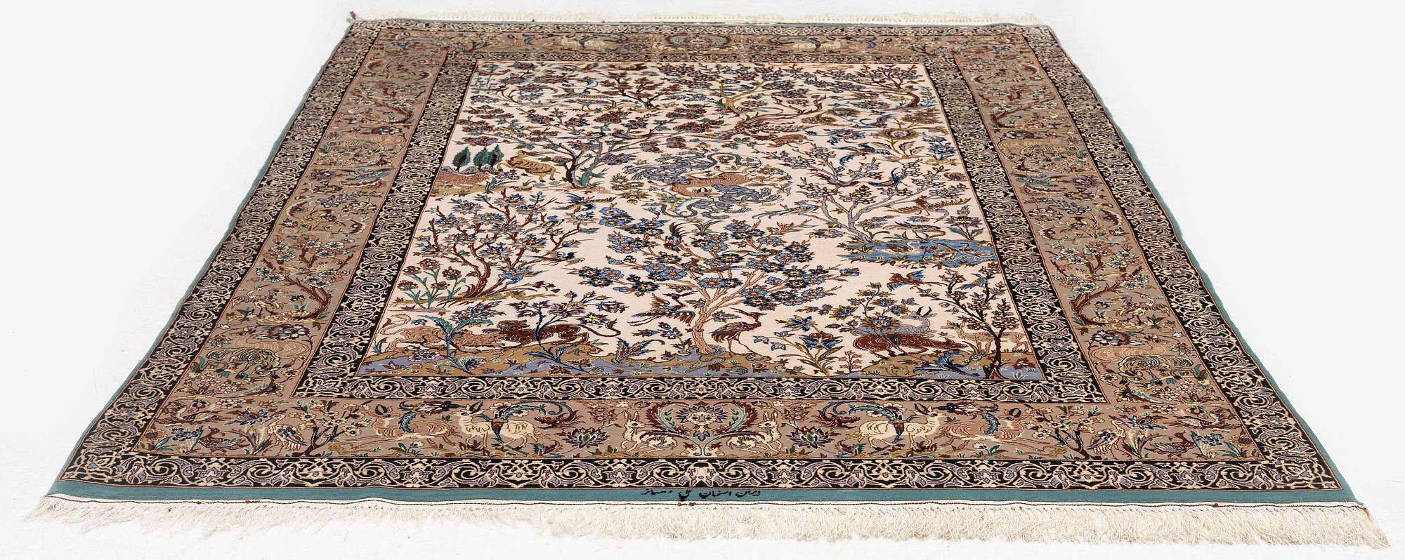 A signed pictoral Isfahan rug, Central Persia (Iran), signed, c. 235 x 154 cm.