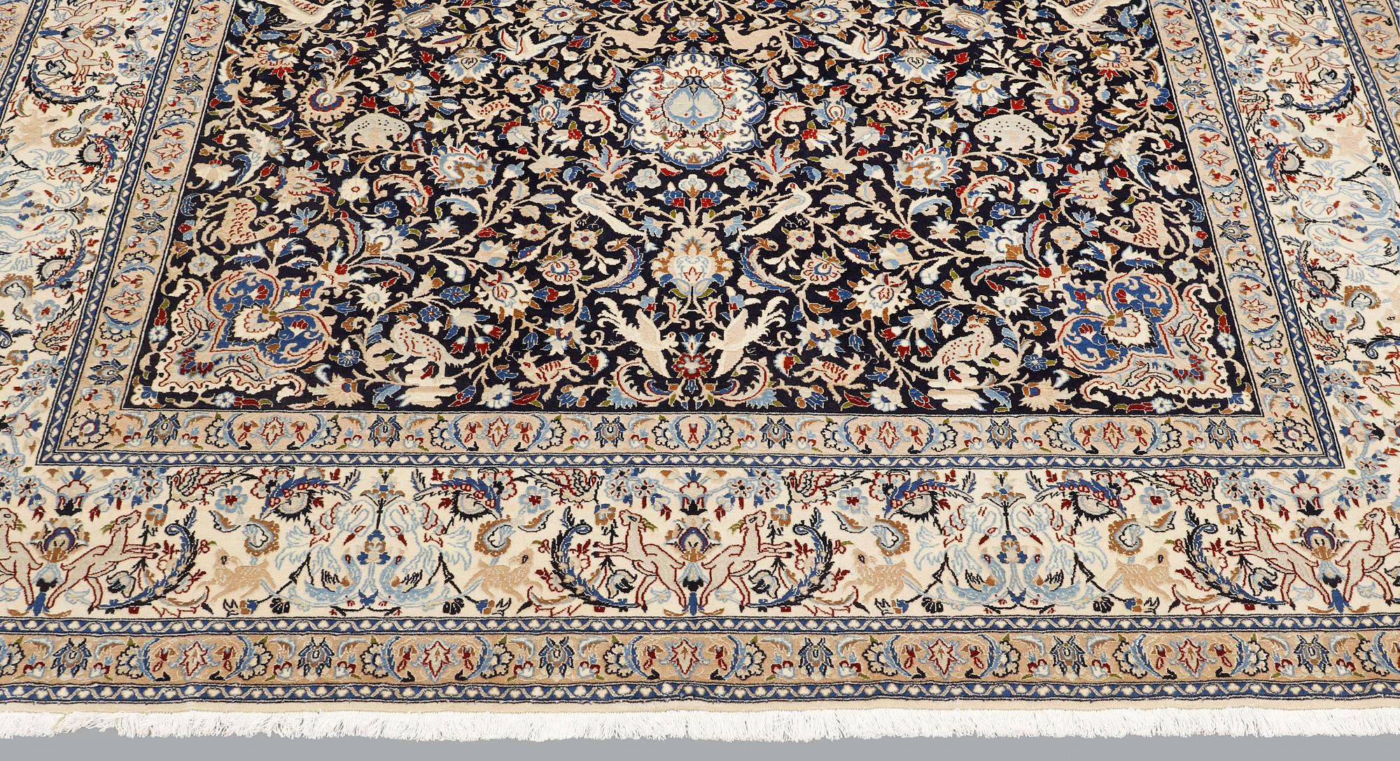 A Nain carpet, part silk, so-called 6 LAA, approx. 324 x 210 cm.