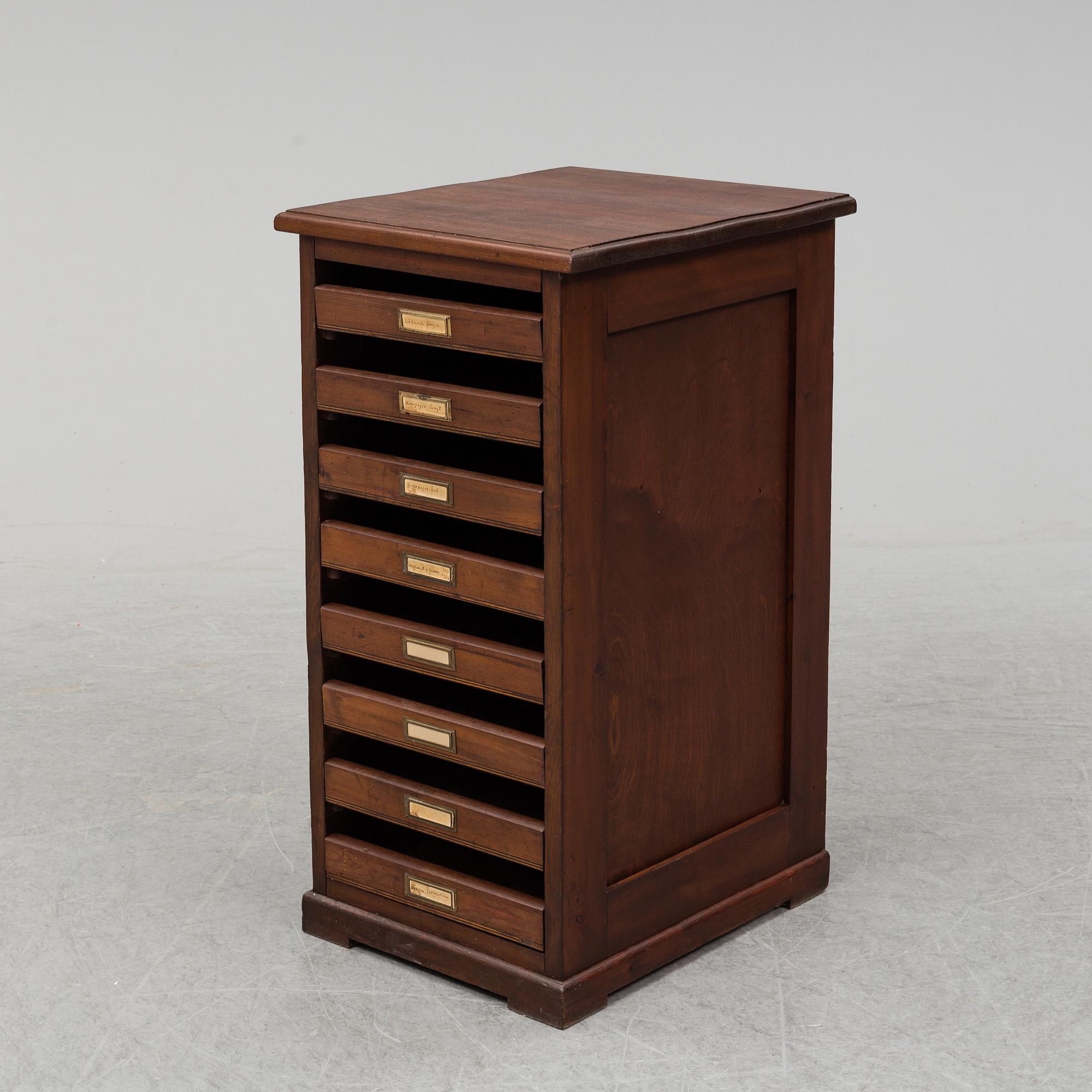 An early 20th Century stained pine office furniture.