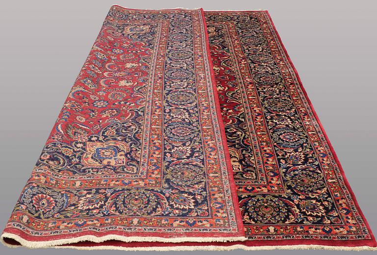 A CARPET, Mashad, signed, ca 385 x 293 cm.