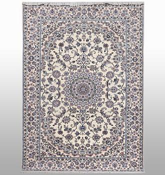 A Nain carpet, part silk, 6 laa, c. 250 x 160 cm.