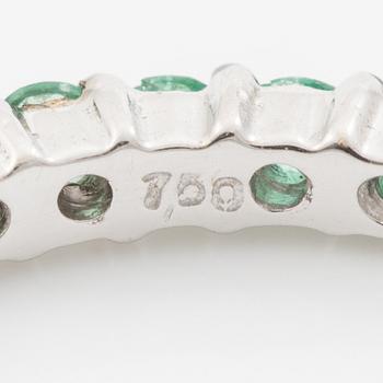 Ring in 18K white gold with brilliant-cut diamonds and emeralds.
