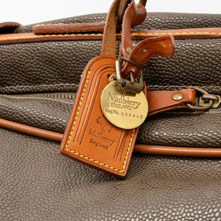 Mulberry, a scotch grain suitcase.