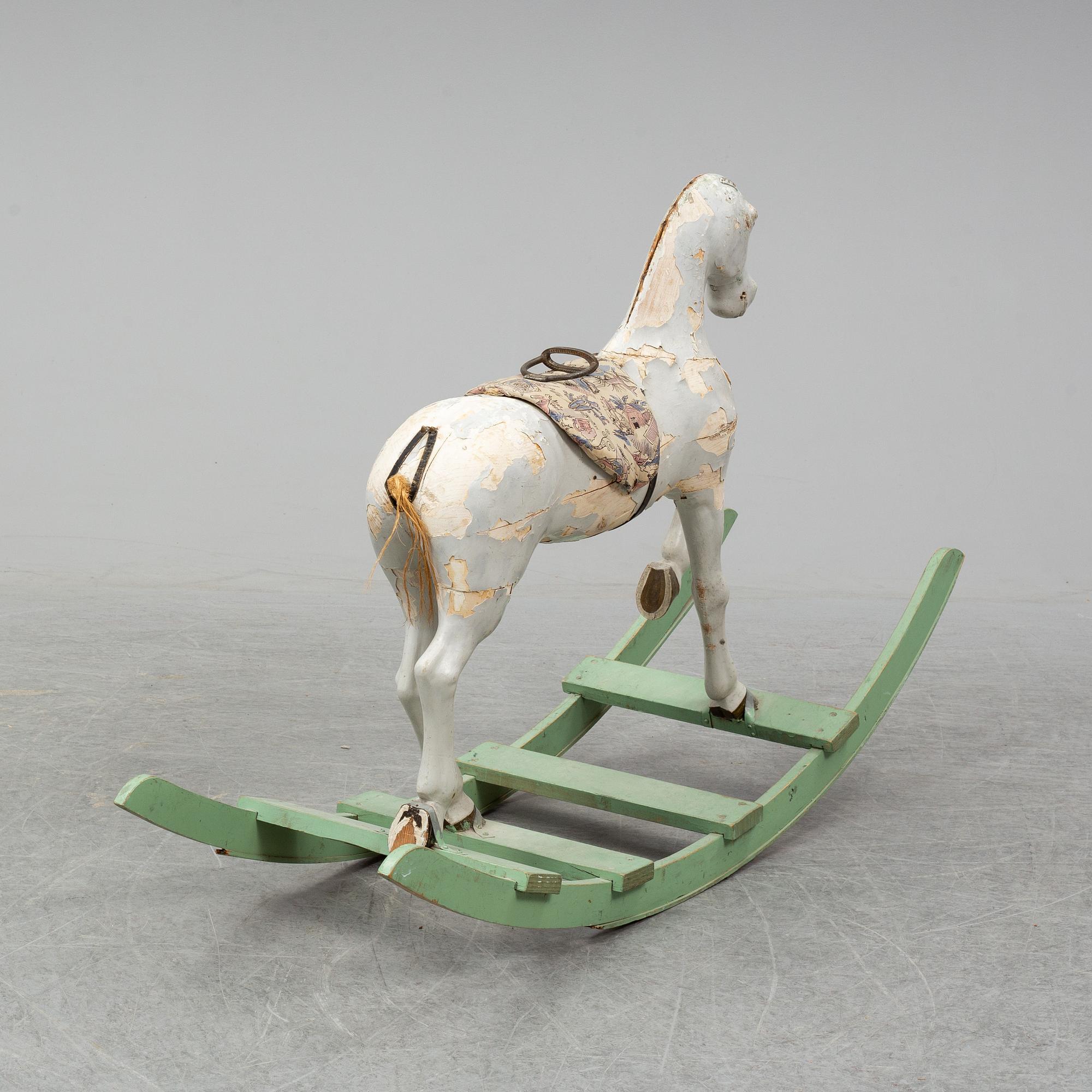 A wooden rocking horse from the early 20th century.