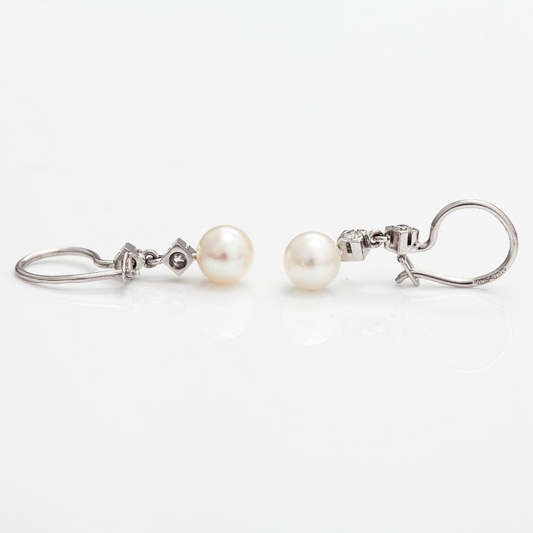 A pair of 18K white gold earrings with cutured pearls and diamonds ca. 0.24 ct in total. Westerback, Helsinki.