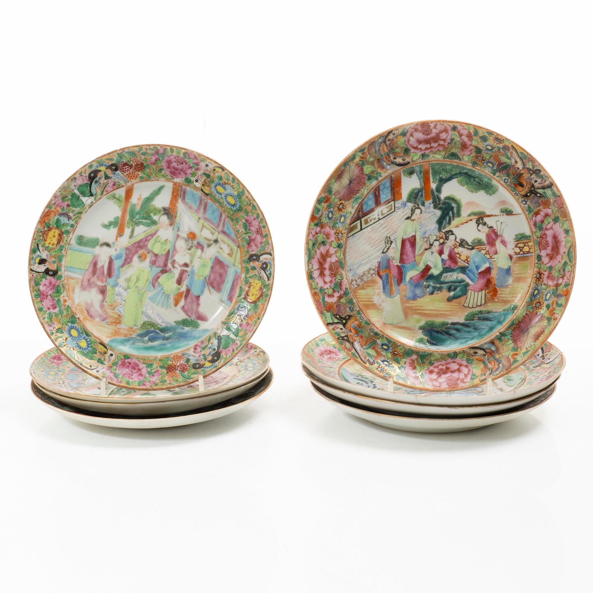 A matched set of 14 famille rose 'Canton' dinner plates, Qing dynasty, 19th century.