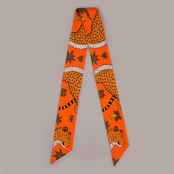 A twirly bandana scarf by Hermès.