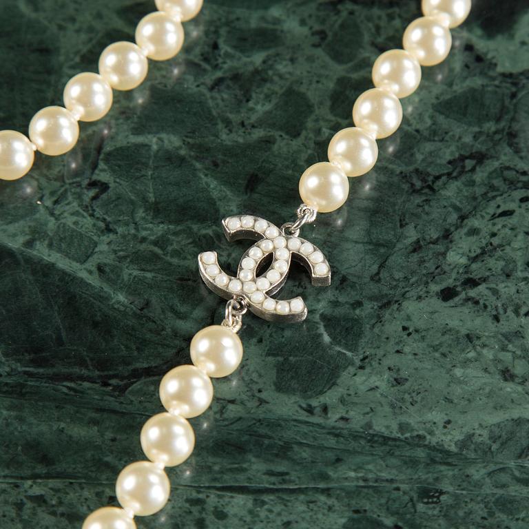 Necklace by Chanel.