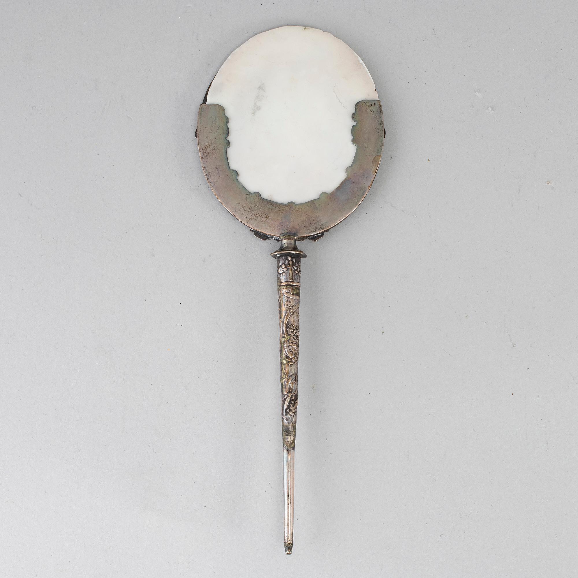 A 19th century silver candle shade.