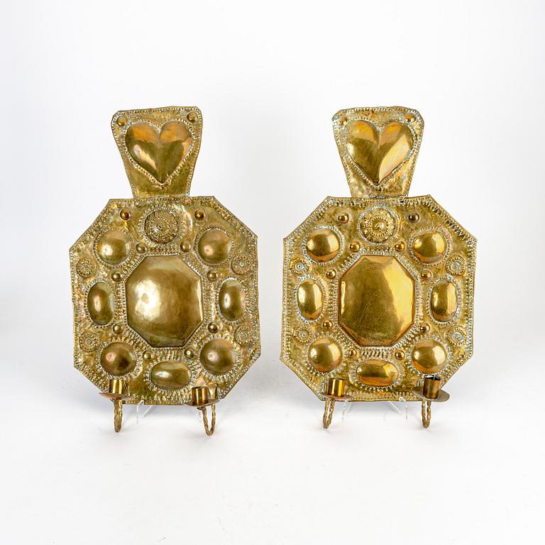 A parr of Baroque style brass wall sconces.