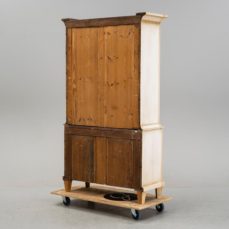 A gustavian style cabinet, circa 1900.